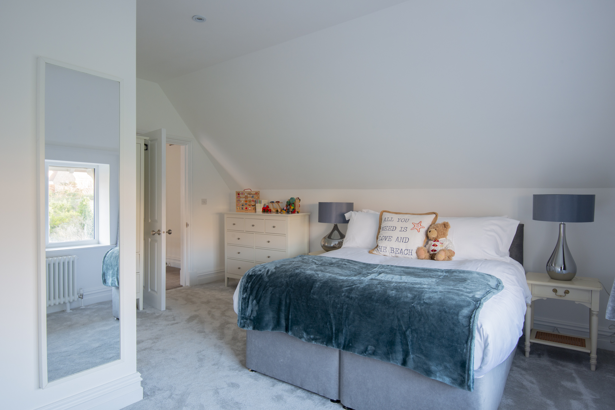 Bedroom 3 — king bed with vaulted ceiling and ensuite shower