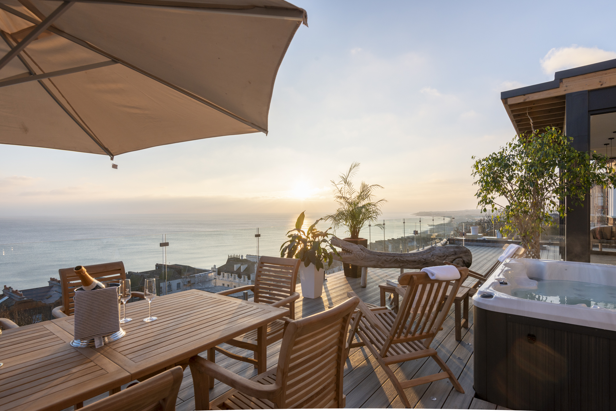 Roof terrace at golden hour with hot tub