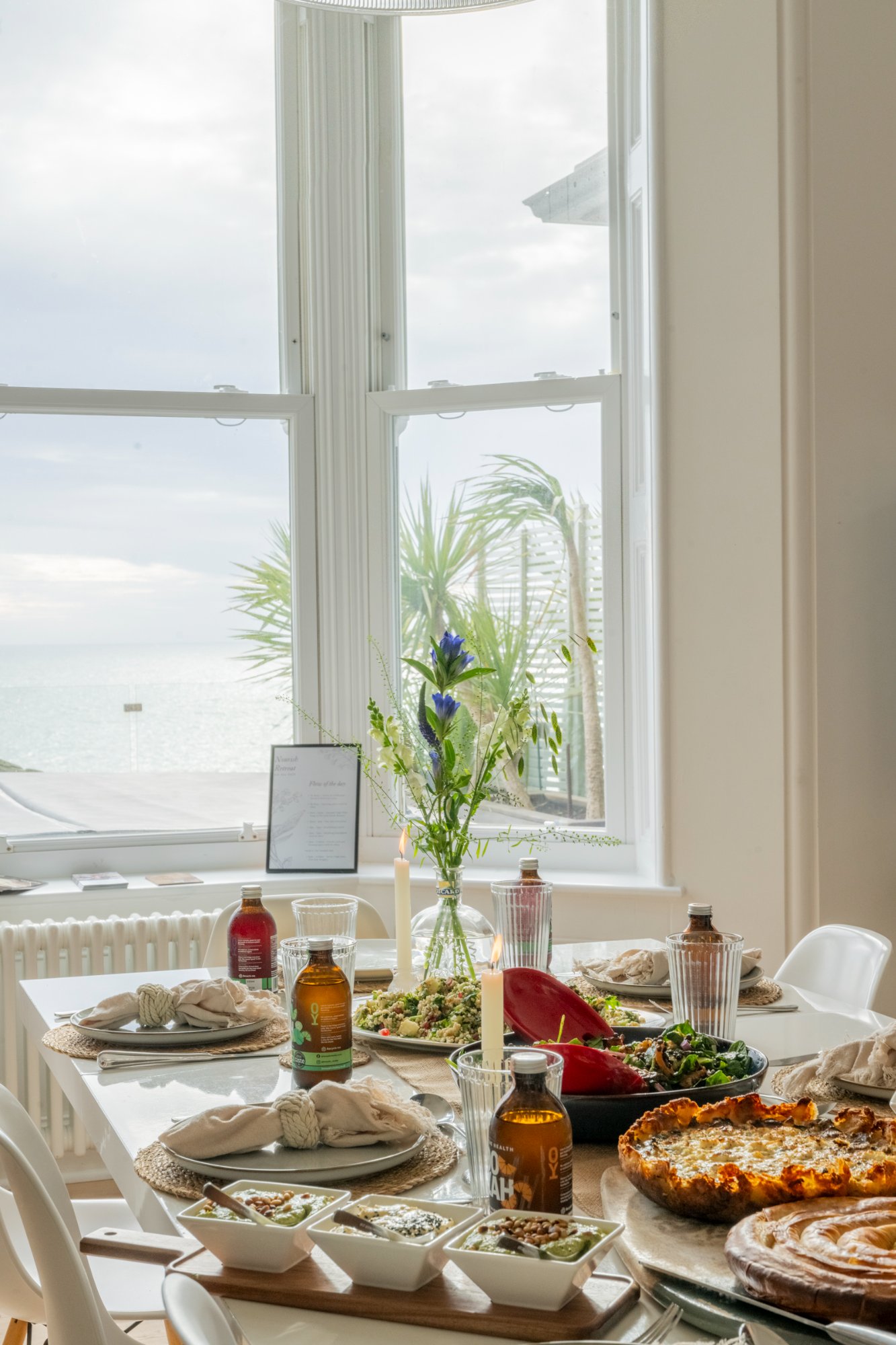 Dining table laid for a feast with sea views