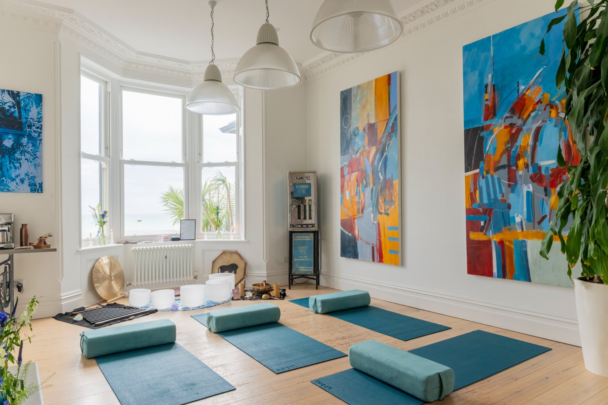 Yoga and wellness retreat setup with mats and sea views