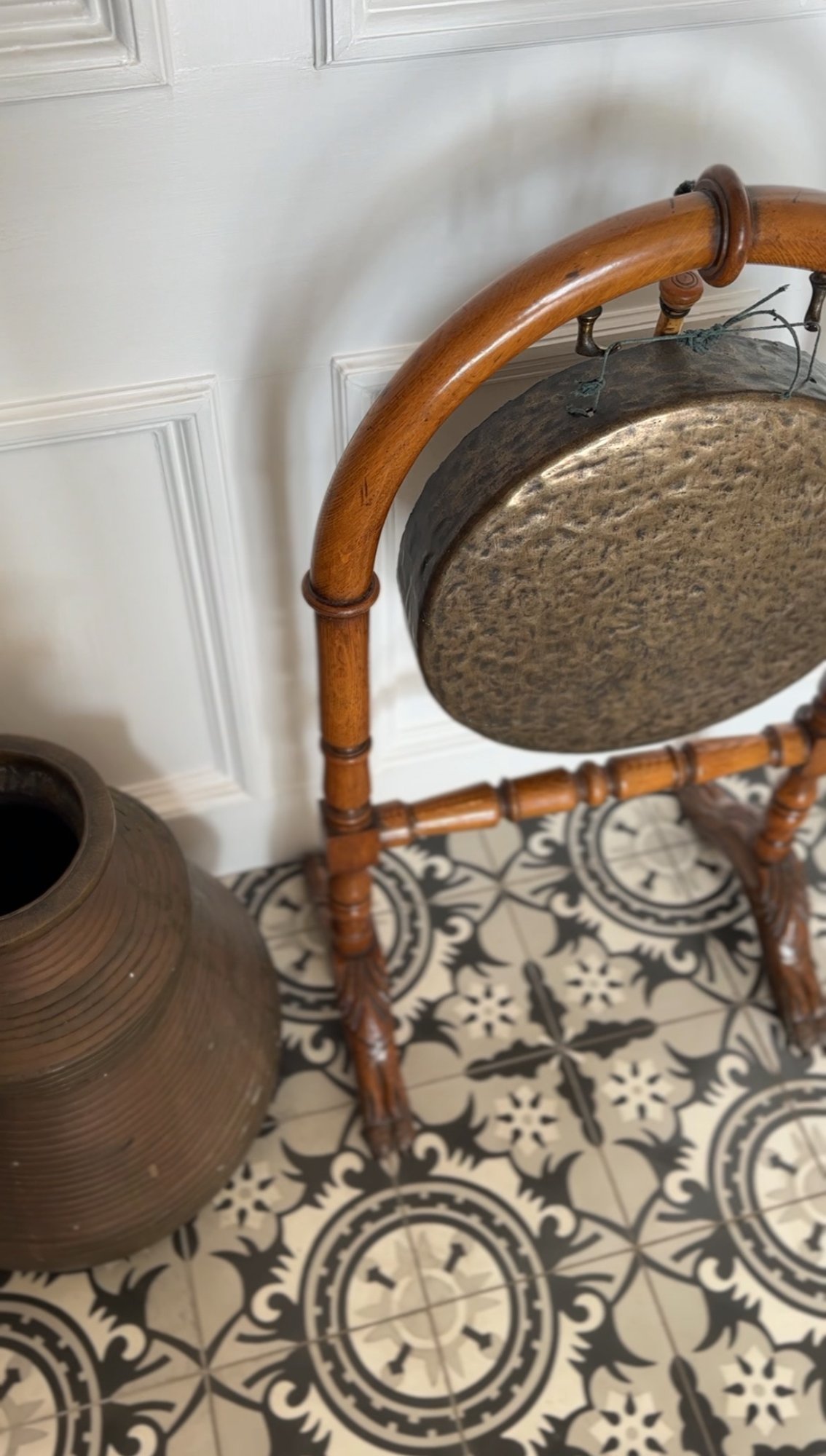 Antique brass gong in entrance hall